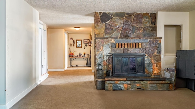 details with a stone fireplace, a textured ceiling, and carpet flooring