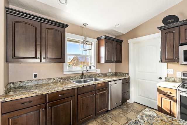 kitchen with sink, dark brown cabinets, stainless steel appliances, decorative light fixtures, and vaulted ceiling