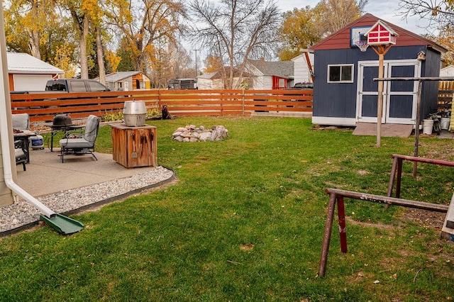 view of yard featuring a patio area and a storage unit