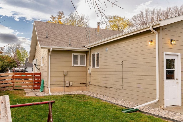 view of home's exterior with a yard