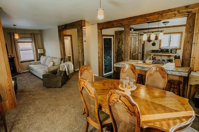 view of carpeted dining space