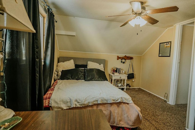 carpeted bedroom with vaulted ceiling and ceiling fan