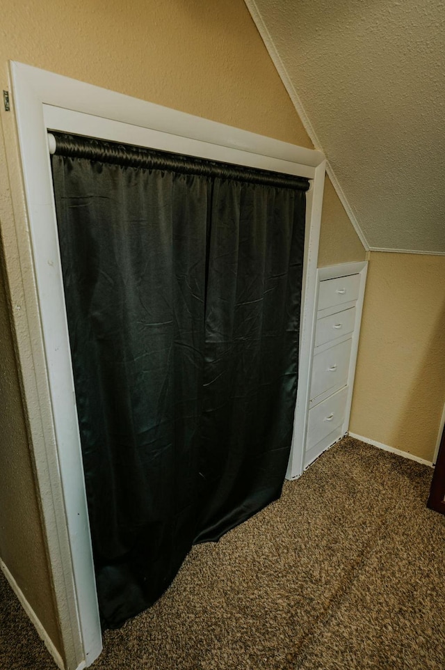 bathroom with lofted ceiling