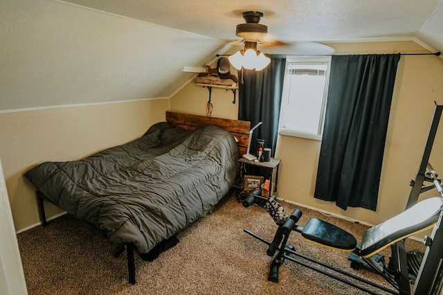 carpeted bedroom featuring ceiling fan, vaulted ceiling, and a textured ceiling