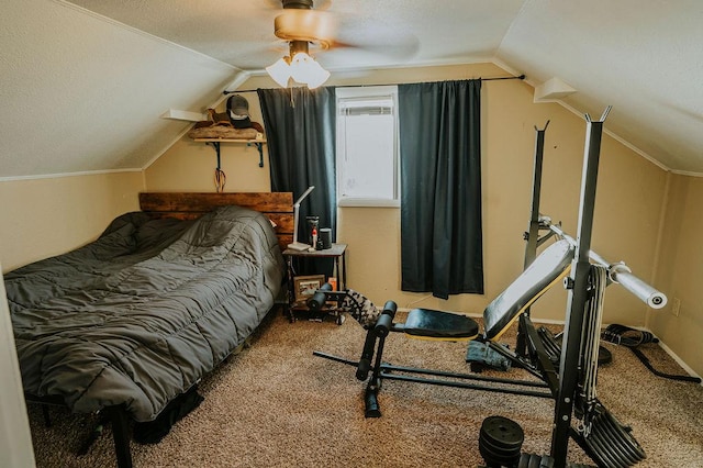 bedroom featuring a textured ceiling, carpet floors, ceiling fan, and vaulted ceiling