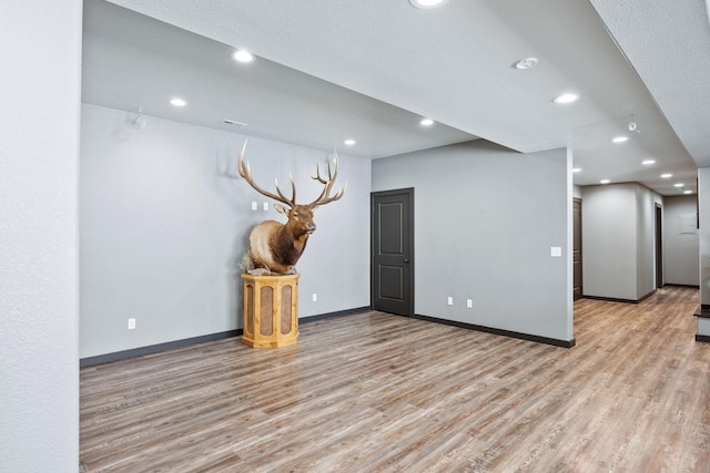 unfurnished room featuring light hardwood / wood-style floors