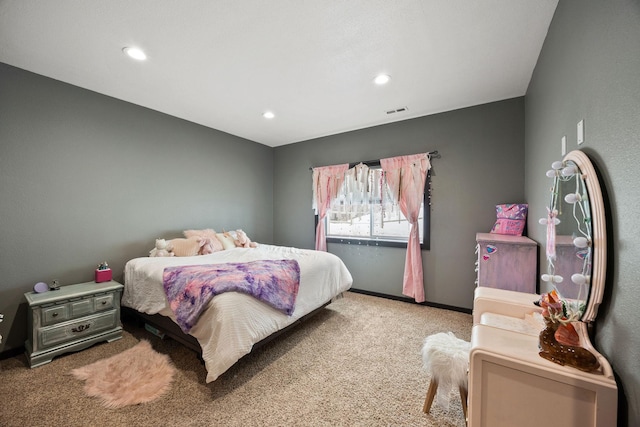 bedroom with light colored carpet