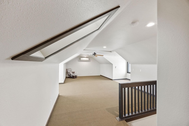 additional living space featuring lofted ceiling, a textured ceiling, and carpet flooring