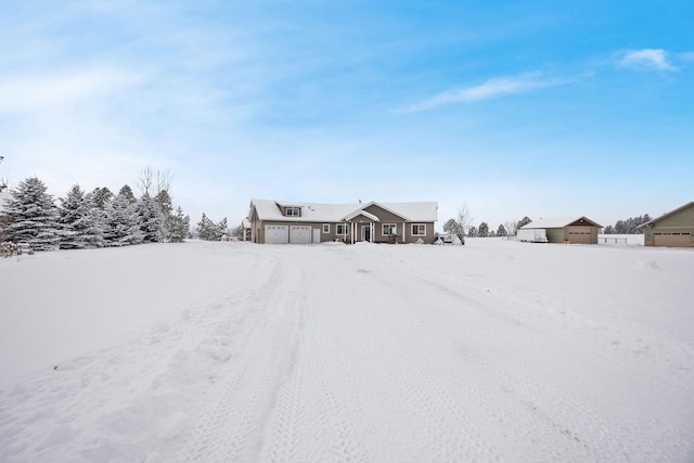 yard layered in snow with a garage