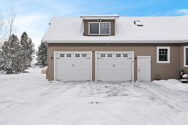 view of snow covered garage