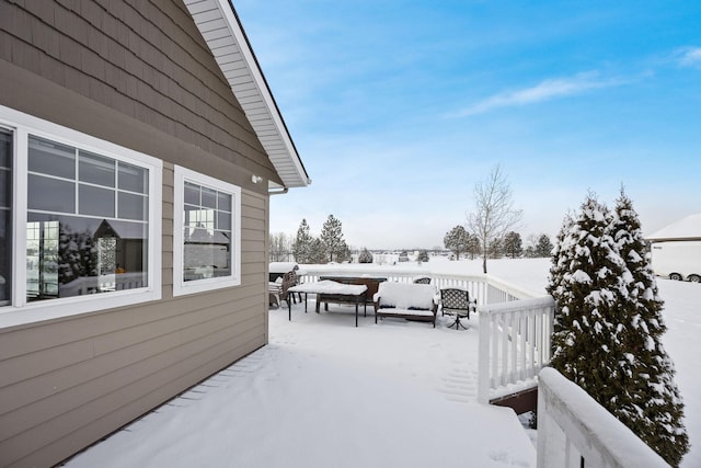 view of snow covered deck