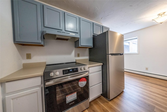 kitchen with stainless steel appliances, blue cabinetry, light hardwood / wood-style floors, and baseboard heating