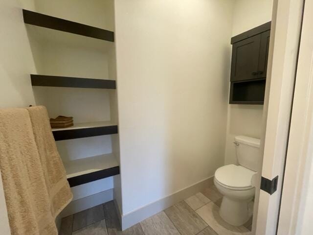 217 Palmer Dr, Kalispell, MT 59901 - bathroom featuring toilet and baseboards