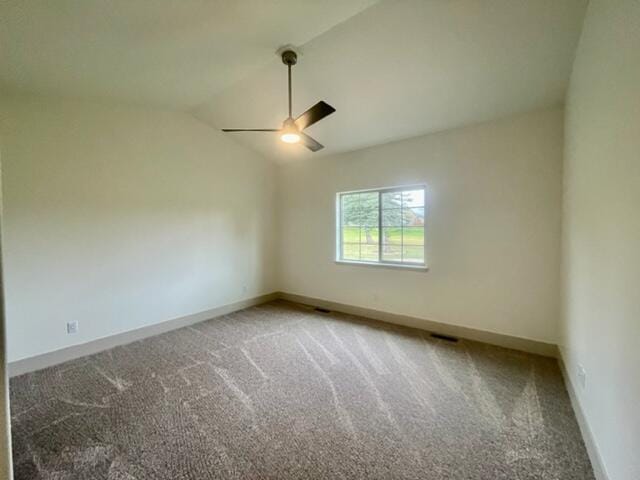 carpeted empty room with lofted ceiling and ceiling fan