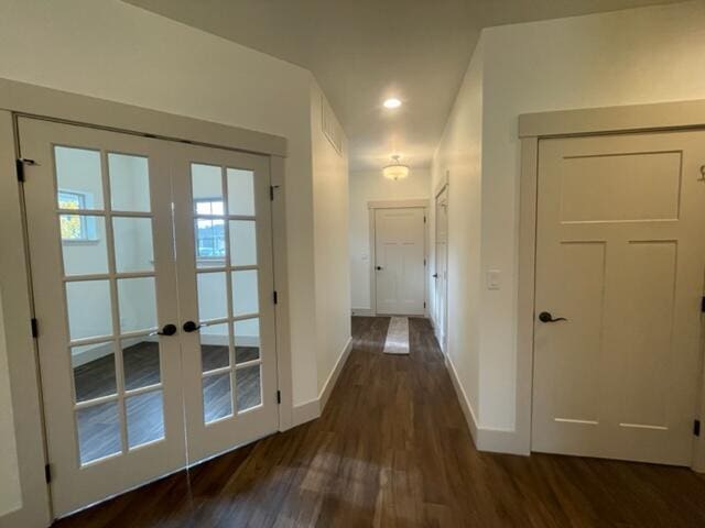 doorway to outside with dark hardwood / wood-style floors and french doors