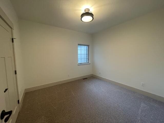 empty room featuring carpet flooring