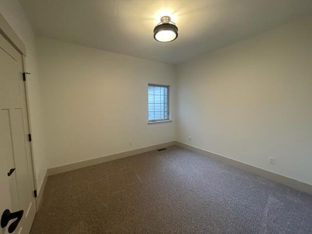 217 Palmer Dr, Kalispell, MT 59901 - carpeted spare room featuring baseboards