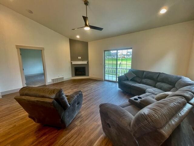 living room with hardwood / wood-style floors, high vaulted ceiling, and ceiling fan