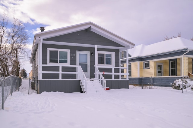 manufactured / mobile home with covered porch and fence