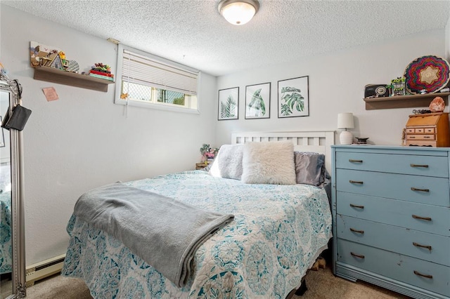 bedroom featuring carpet floors, a baseboard heating unit, and a textured ceiling