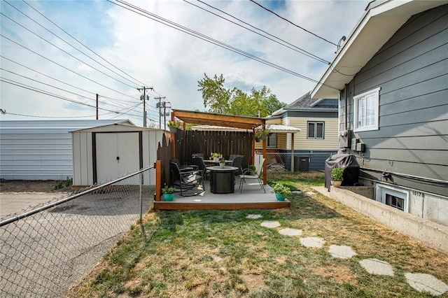 view of yard featuring a pergola, an outdoor fire pit, a patio, and a storage unit