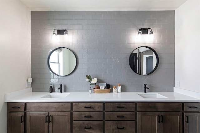 bathroom featuring vanity and decorative backsplash