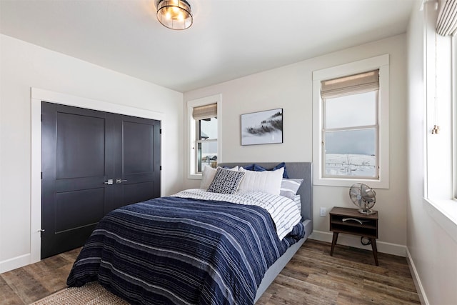 bedroom featuring a closet and dark hardwood / wood-style floors