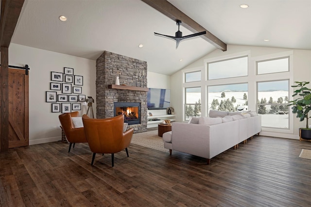 living room with dark hardwood / wood-style floors, a fireplace, a barn door, and beam ceiling