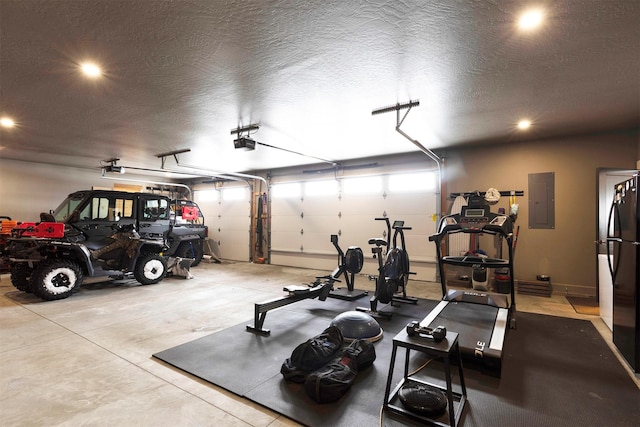 workout room with electric panel and a textured ceiling