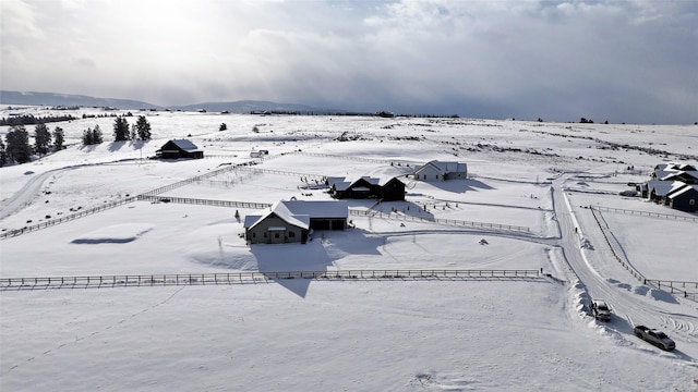 snowy aerial view featuring a mountain view