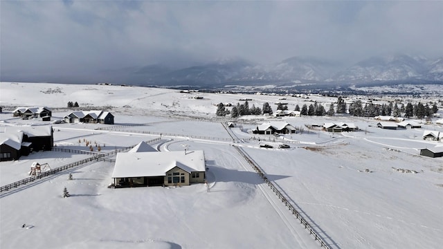 snowy aerial view with a mountain view