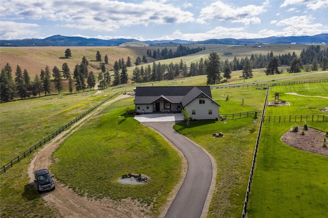 birds eye view of property featuring a mountain view and a rural view