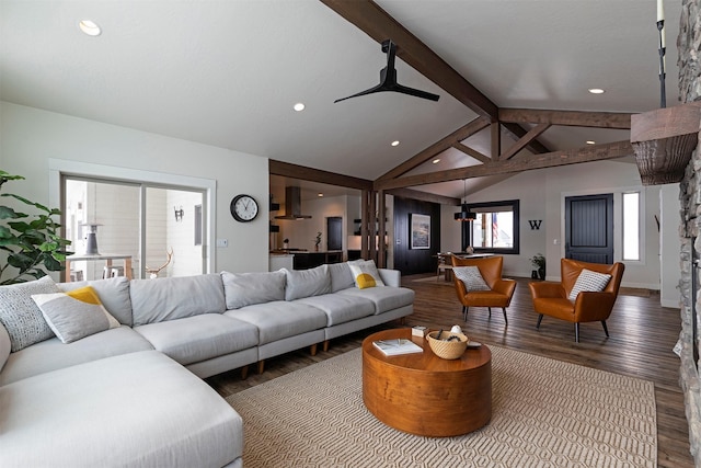 living room featuring vaulted ceiling with beams and hardwood / wood-style flooring