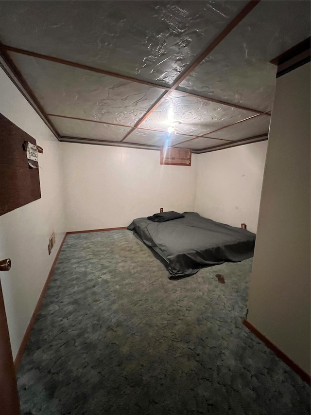 unfurnished bedroom featuring carpet flooring and baseboards