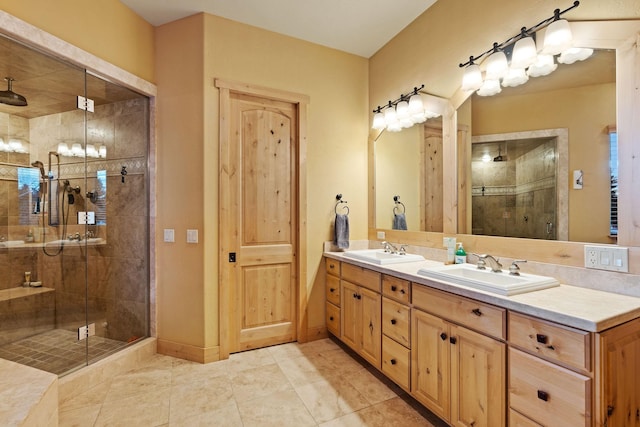 bathroom featuring an enclosed shower, vanity, and tile patterned floors