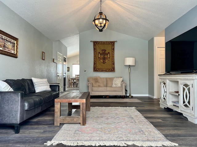 living room featuring lofted ceiling, dark hardwood / wood-style floors, a textured ceiling, and a notable chandelier