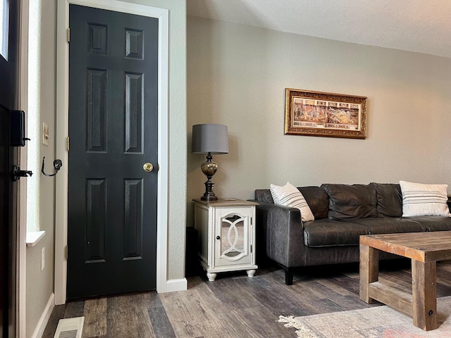 living room featuring dark hardwood / wood-style floors