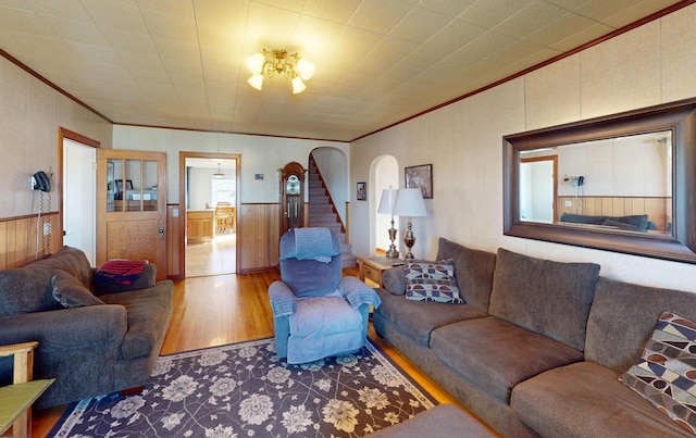 living room with hardwood / wood-style flooring and ornamental molding