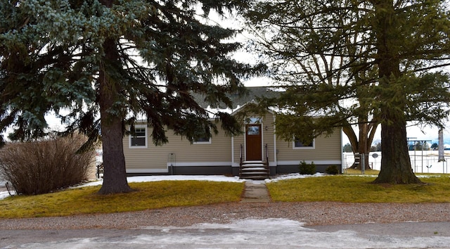 view of front of home with a front lawn