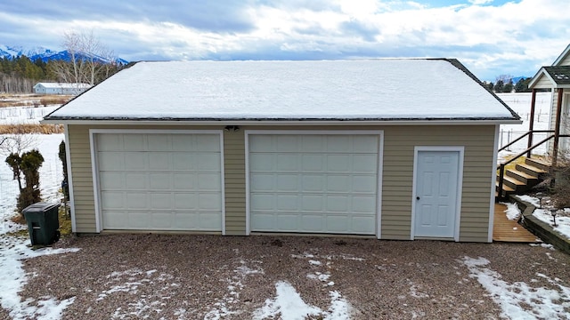 view of snow covered garage