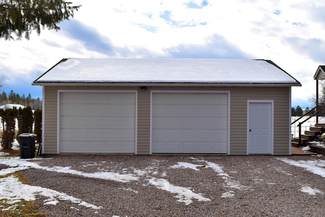 view of snow covered garage