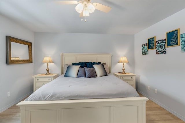 bedroom with light hardwood / wood-style floors and ceiling fan