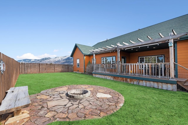 view of yard with a patio, an outdoor fire pit, a mountain view, a pergola, and a fenced backyard