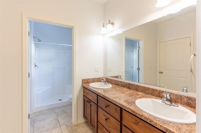 28 Talbot Pines Loop, Columbia Falls, MT 59912 - full bathroom with double vanity, tile patterned flooring, and walk in shower