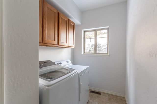 28 Talbot Pines Loop, Columbia Falls, MT 59912 - laundry area with cabinet space and washing machine and dryer