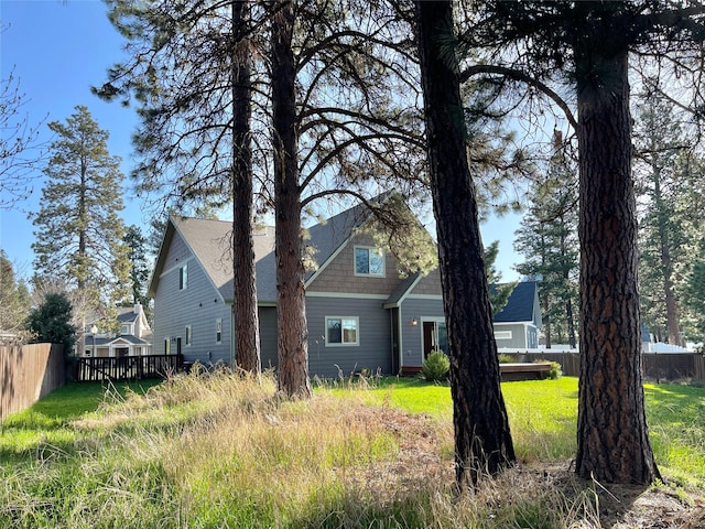 view of front of property featuring fence