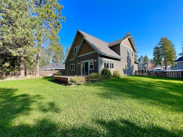 28 Talbot Pines Loop, Columbia Falls, MT 59912 - back of house featuring a fenced backyard and a patio area