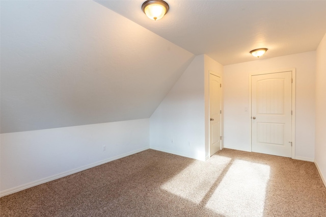 28 Talbot Pines Loop, Columbia Falls, MT 59912 - additional living space with light colored carpet and lofted ceiling