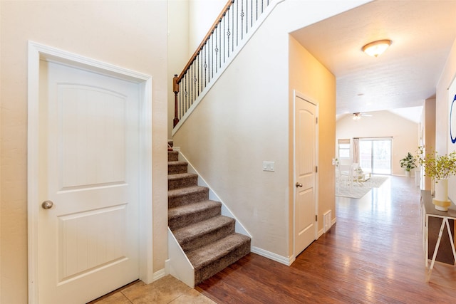 28 Talbot Pines Loop, Columbia Falls, MT 59912 - stairway featuring wood finished floors, lofted ceiling, and ceiling fan
