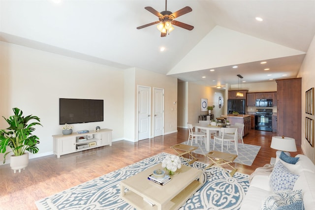 28 Talbot Pines Loop, Columbia Falls, MT 59912 - living area with high vaulted ceiling, dark wood-style floors, ceiling fan, and recessed lighting